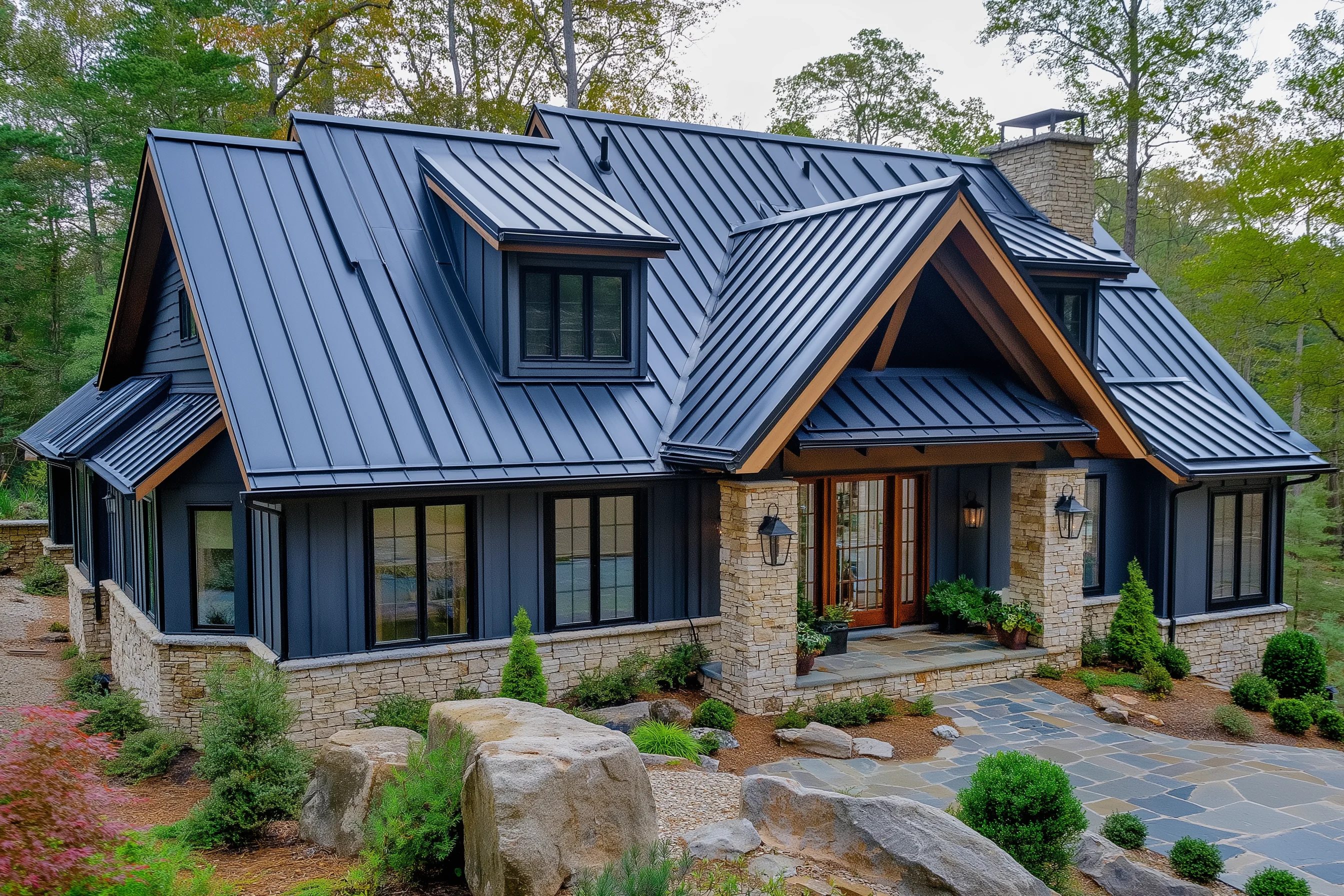 Standing seam metal roof on a home with stone accents and wood gable details